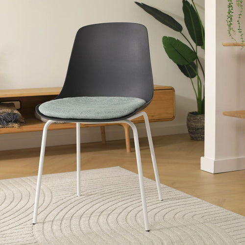 Nolon Nora-Liv Eetkamerstoel Zwart - Zacht Groen Kussen - Witte Poten - vtwonen shop