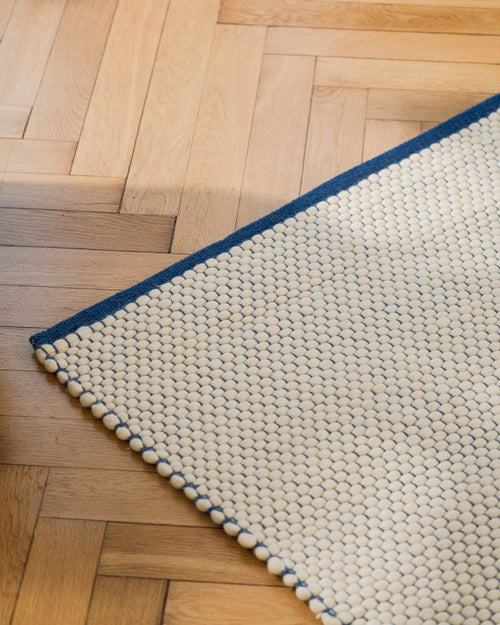 noo.ma handgeweven vloerkleed van Nieuw-Zeelandse wol - laagpolig, gestructureerd, rechthoekig