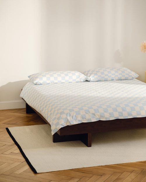 noo.ma handgeweven vloerkleed van Nieuw-Zeelandse wol, beige met Vulcano Black randaccent - rechthoekig, laagpolig 1 cm