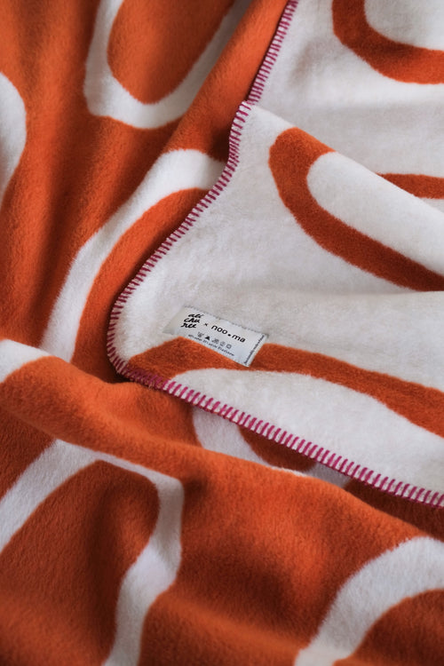 noo.ma SWIRL Katoenen deken - Terracotta
