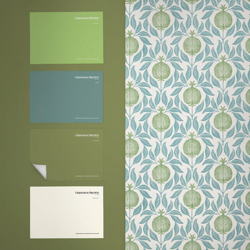 Graham & Brown Vliesbehang - Apple of Grenada Blue & Green